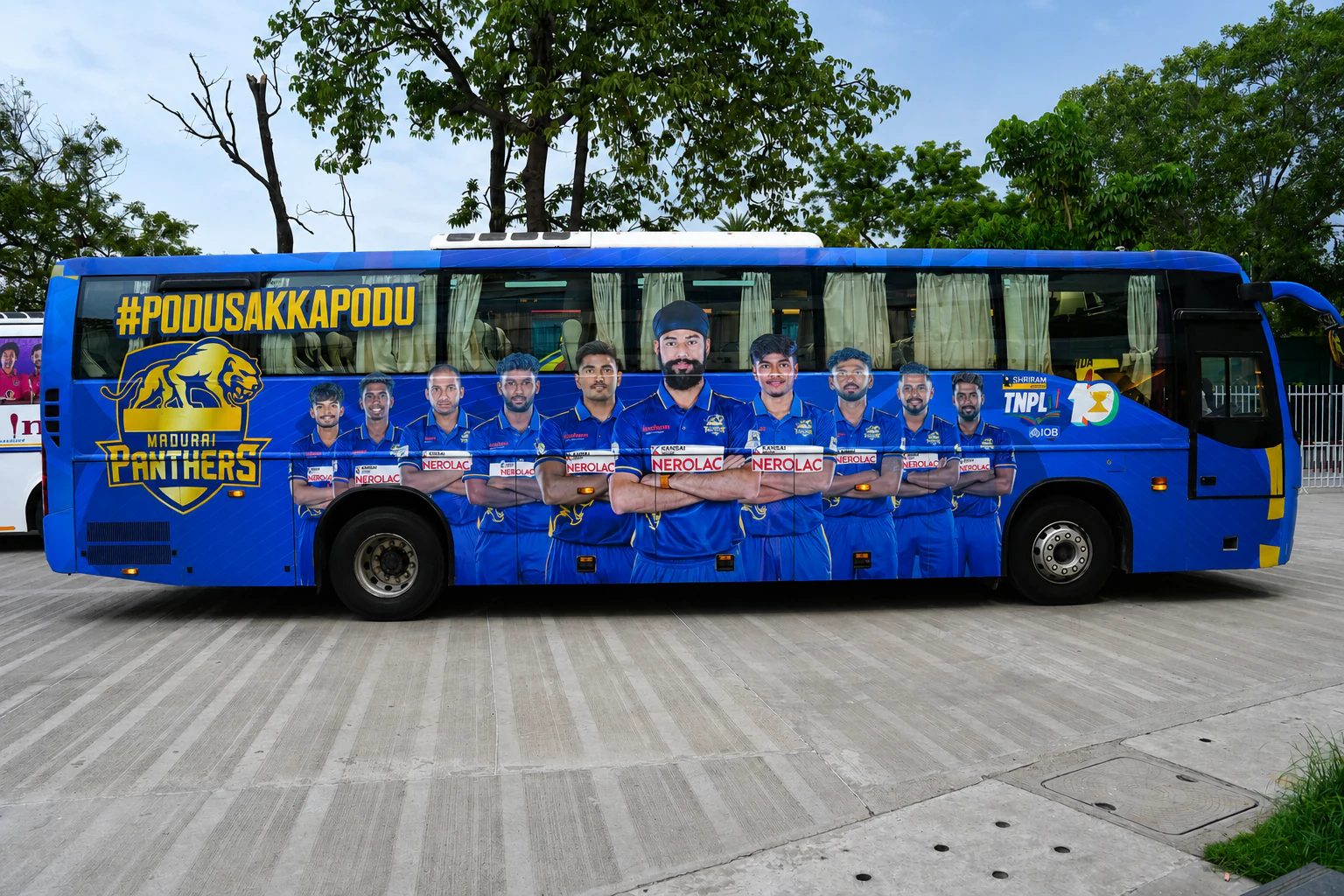 Madurai Panthers team artwork across the side of the team bus