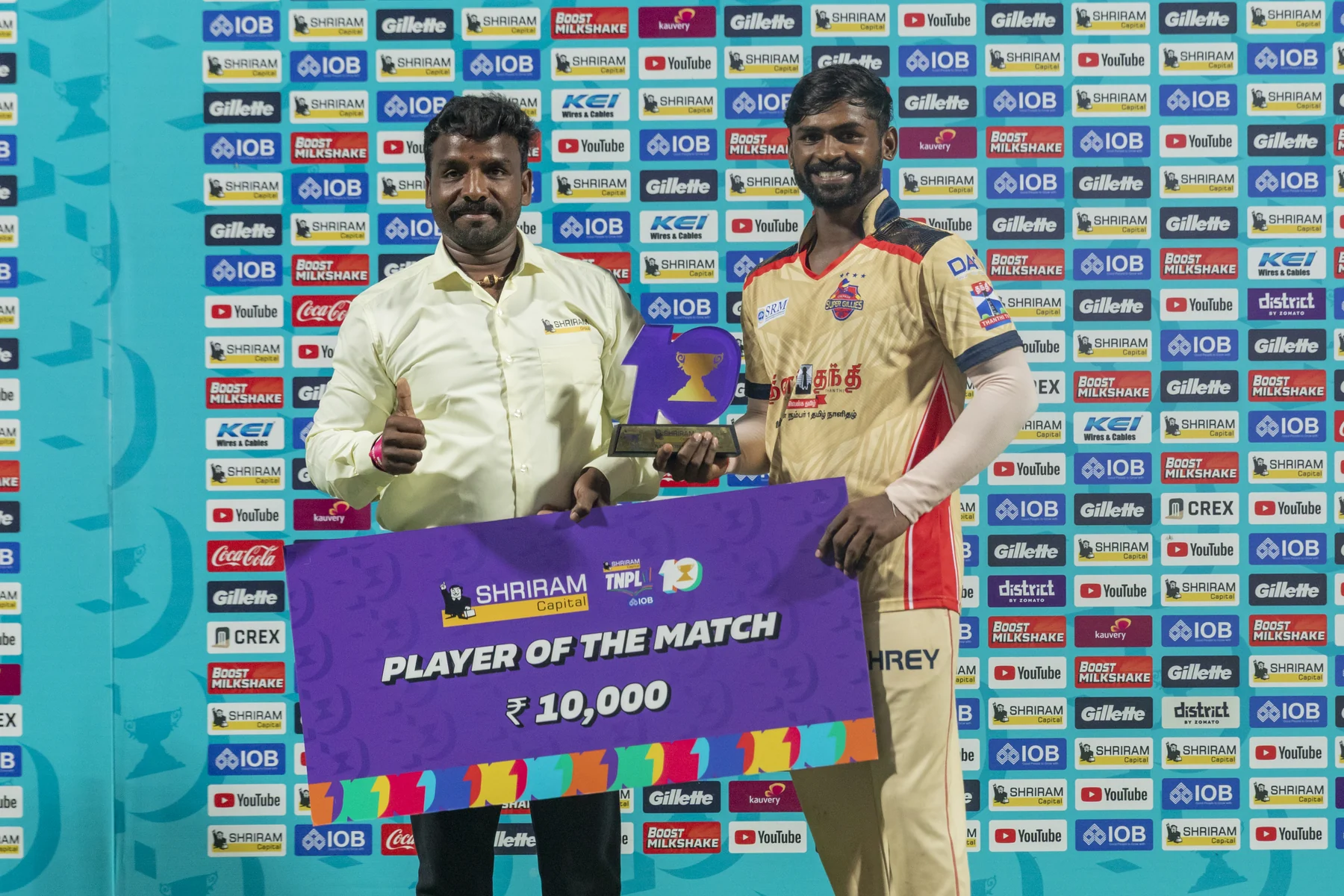 Chepauk Super Gillies player receiving the Player of the Match award