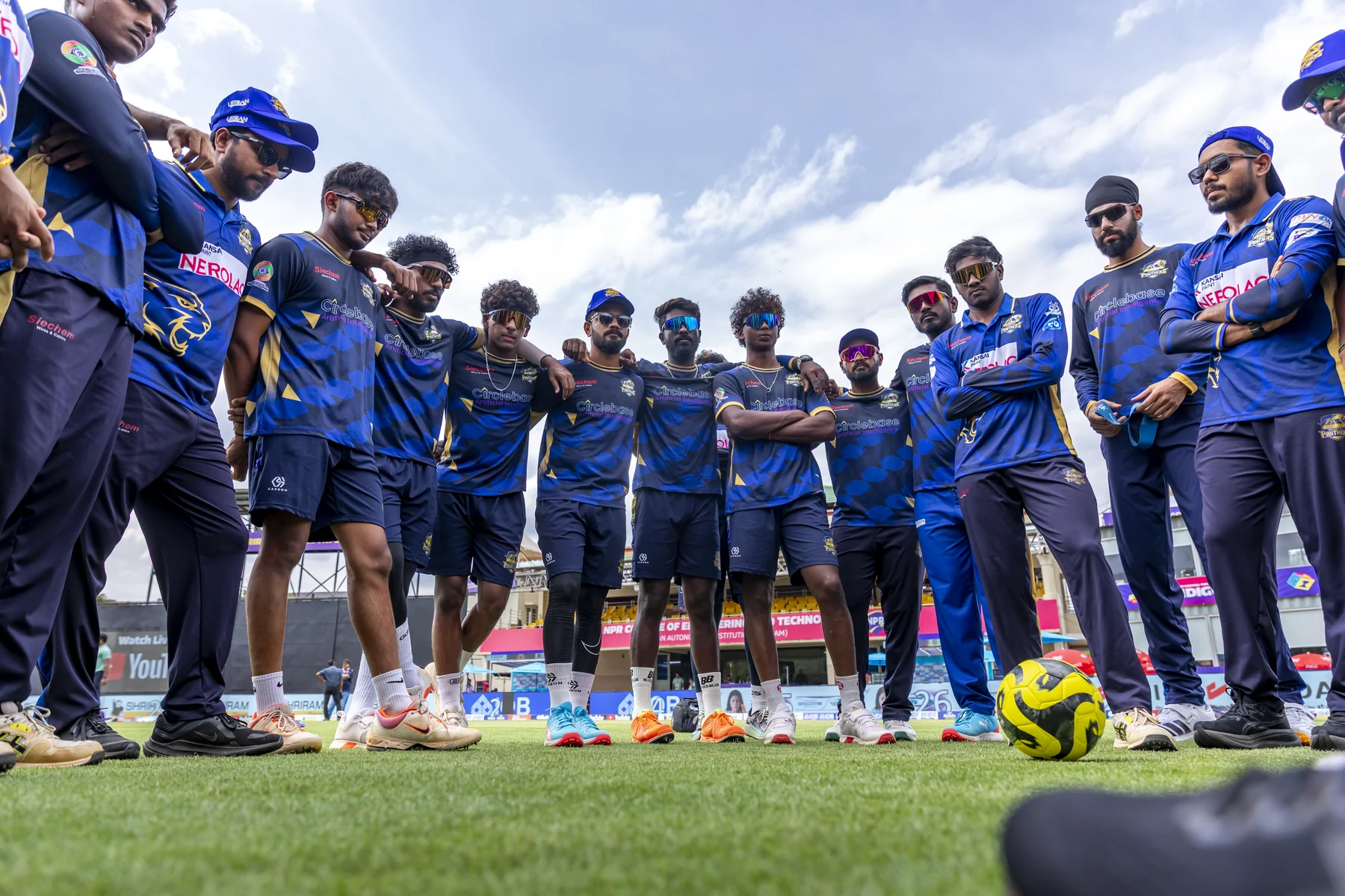 Madurai Panthers players together during a practice huddle