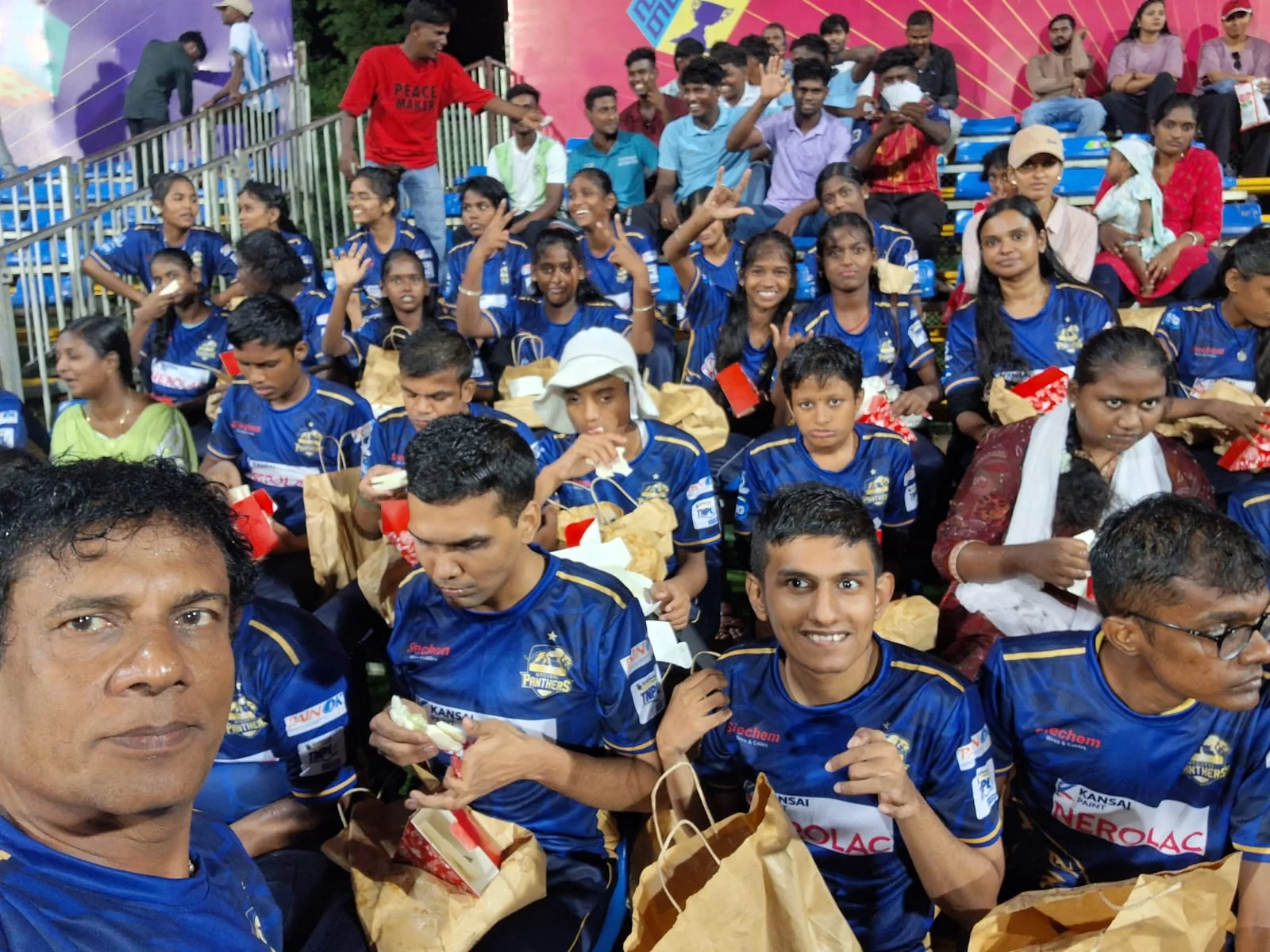 Young Panthers supporters together in the Natham stadium stands