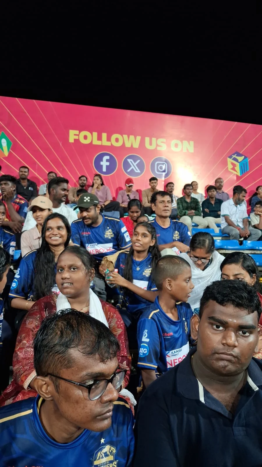 Panthers representatives seated with young guests at Natham